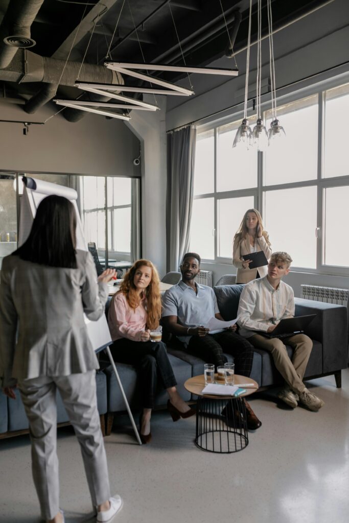A team of professionals engaged in a business meeting in a modern office setting.